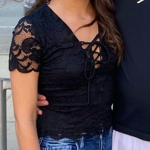 Short-sleeved black lace top.